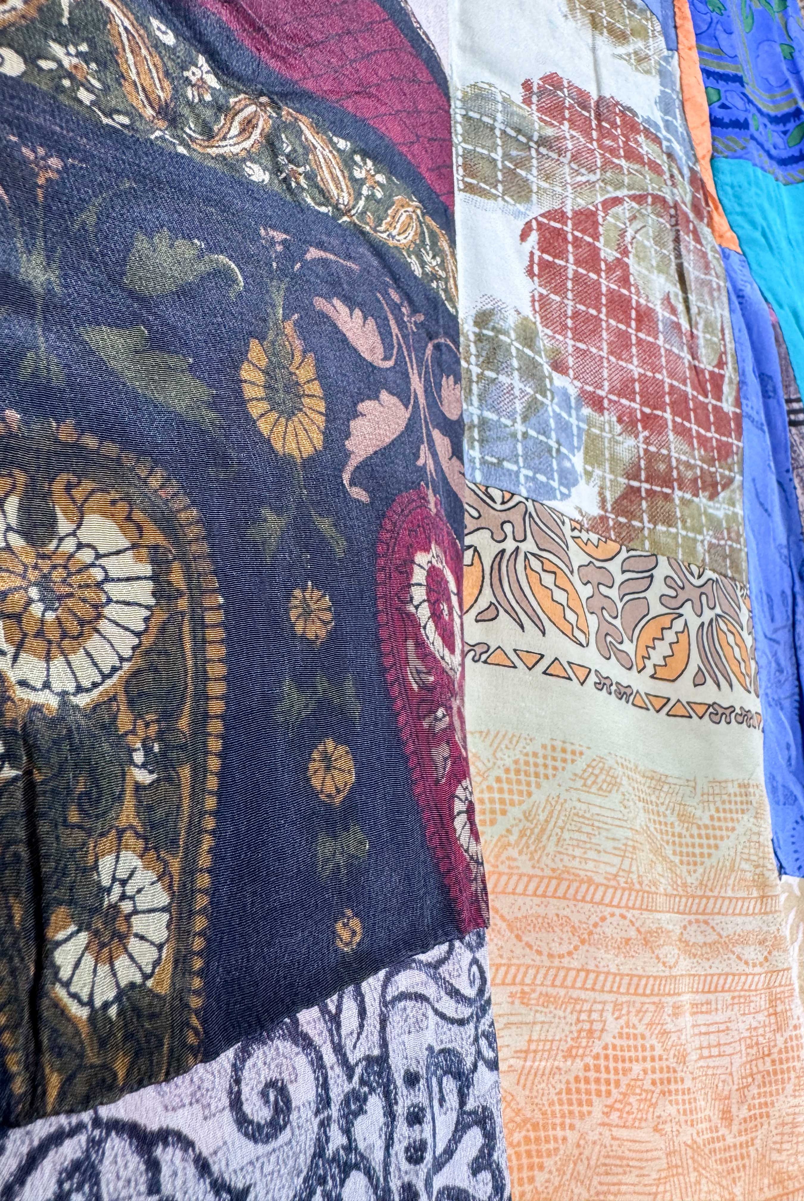 Close-up of various patterned fabrics with intricate designs - Love Protect Sustain