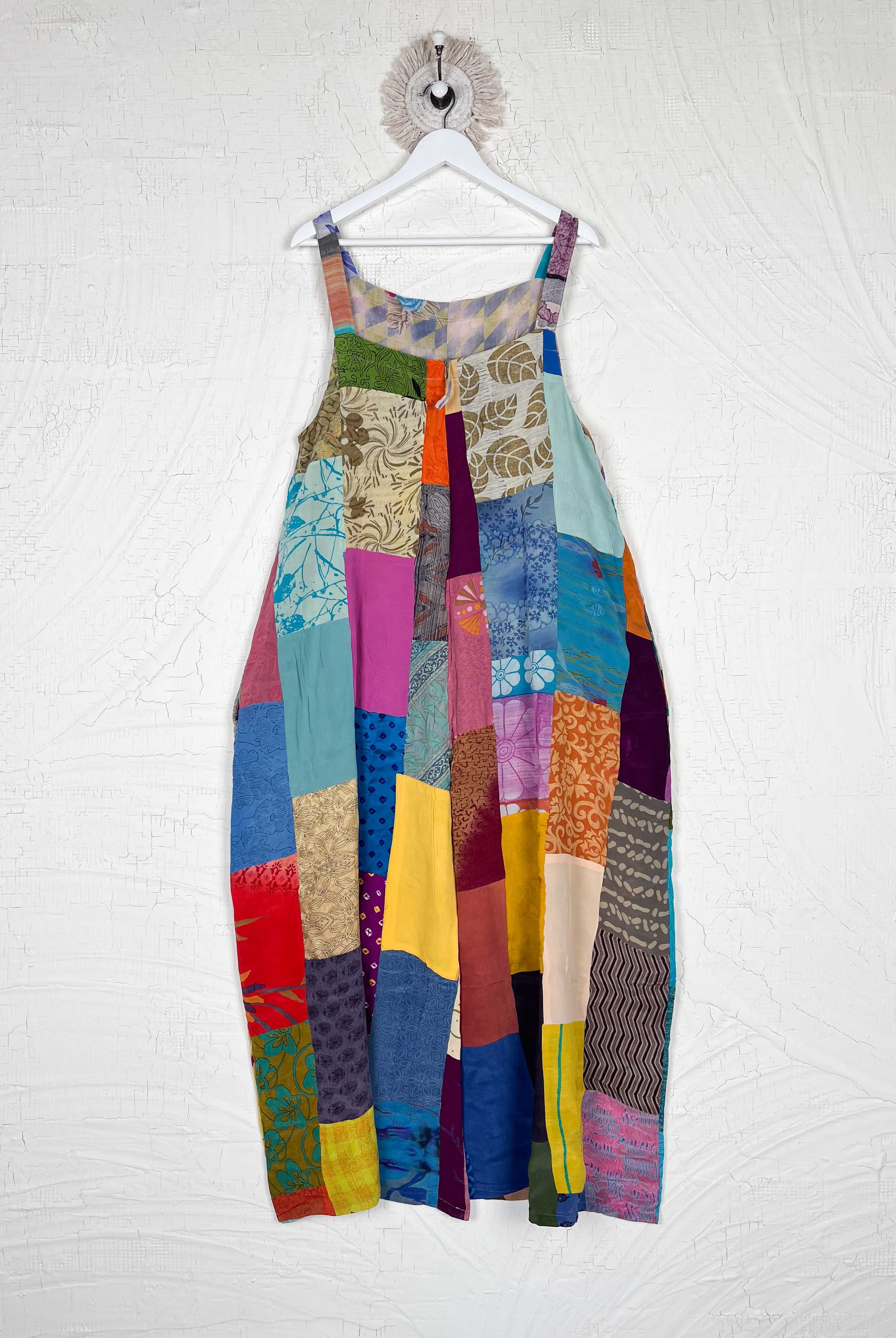 Colorful patchwork dress on a hanger - Love Protect Sustain