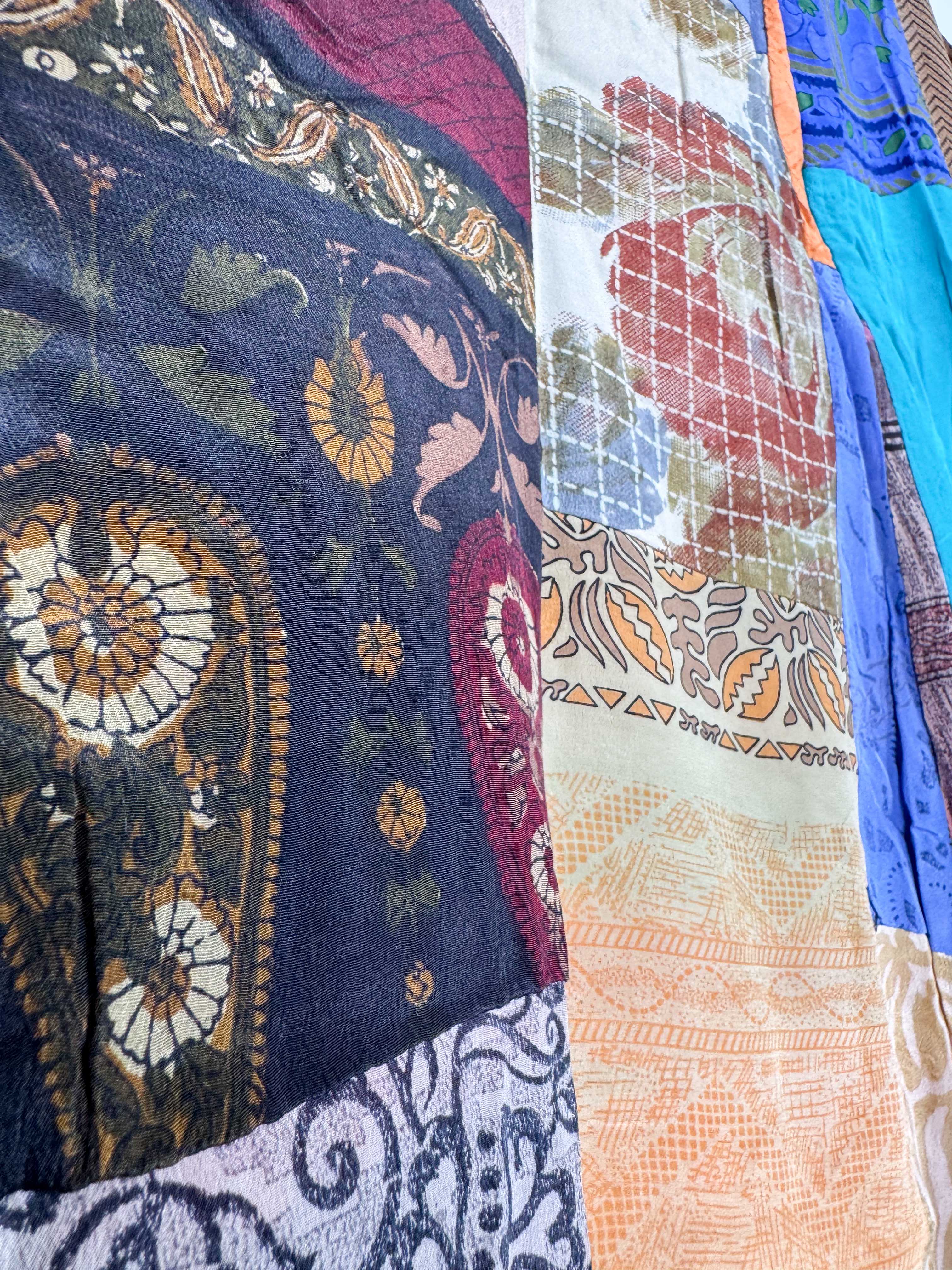 Close-up of various patterned fabrics with intricate designs - Love Protect Sustain