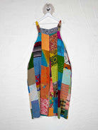Colorful patchwork jumpsuit on a white wall - Love Protect Sustain